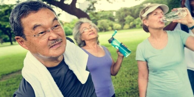 Group of Elderly Hydrating After Exercise at Independent Living Facility