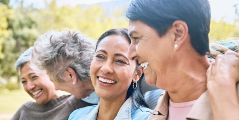 Elderly Women Smiling Closely Together at Independent Living Facility